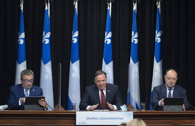 February 9, 2021, QUEBEC, PQ, Canada: Quebec Premier Francois Legault speaks during a news conference on the COVID-19 pandemic, Tuesday, February 9, 2021 at the legislature in Quebec City. Legault is flanked by Horacio Arruda, Quebec director of National Public Health, left, and Quebec Health Minister Christian Dube. QUEBEC Canada - ZUMAc35_ 20210209_zaf_c35_017 Copyright: xJacquesxBoissinotx