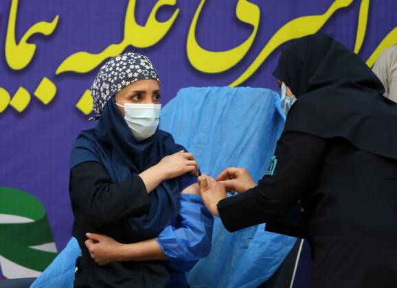 (210209) -- TEHRAN, Feb. 9, 2021 -- A nurse receives the COVID-19 vaccine at a hospital in Tehran, Iran, on Feb. 9, 2021. Iran on Tuesday started the nationwide vaccination campaign against COVID-19, using Russia s Sputnik V jabs, official news agency IRNA reported. (Photo by Xinhua) IRAN-TEHRAN-COVID-19-VACCINATION CAMPAIGN-START AhmadxHalabisaz 