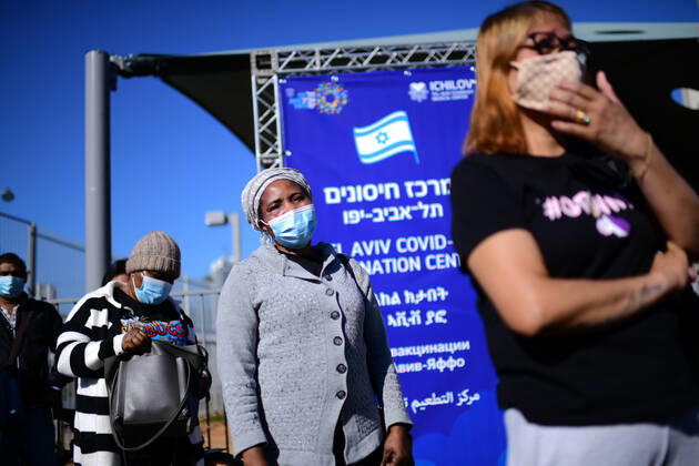 (210209) -- TEL AVIV, Feb. 9, 2021 -- People wait to receive the COVID-19 vaccine at a medical center in Tel Aviv, Israel, Feb. 9, 2021. Israel s Ministry of Health reported 6,574 new COVID-19 cases on Tuesday, raising the tally of confirmed cases in the country to 703,102. ( JINI via Xinhua) ISRAEL-TEL AVIV-COVID-19-CASES-SEVEN MILLION GideonxMarkowicz 