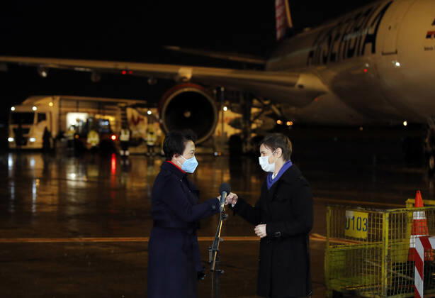(210211) -- BELGRADE, Feb. 11, 2021 -- Serbian Prime Minister Ana Brnabic (R) and Chinese Ambassador to Serbia Chen Bo attend a welcoming event of China s Sinopharm vaccine at the Belgrade Airport, Serbia, Feb. 10, 2021. A second shipment of Sinopharm s COVID vaccine arrived from China at the Belgrade Airport on Wednesday night. (Photo by Xinhua) SERBIA-BELGRADE-COVID-19-VACCINE-SECOND SHIPMENT PredragxMilosavljevic 