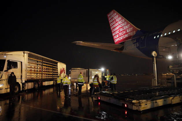 (210211) -- BELGRADE, Feb. 11, 2021 -- Workers unload a container of China s Sinopharm vaccines at the Belgrade Airport, Serbia, Feb. 10, 2021. A second shipment of Sinopharm s COVID vaccine arrived from China at the Belgrade Airport on Wednesday night. (Photo by Xinhua) SERBIA-BELGRADE-COVID-19-VACCINE-SECOND SHIPMENT PredragxMilosavljevic 