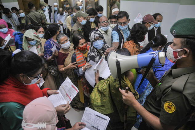February 11, 2021: People gathered in line to take Covid 19 , vaccination at M A G Osmani Medical College and Hospital, Vaccination Center, Sylhet, Bangladesh - ZUMAr143 20210211_zap_r143_014 Copyright: xMdxRafayatxHaquexKhanx