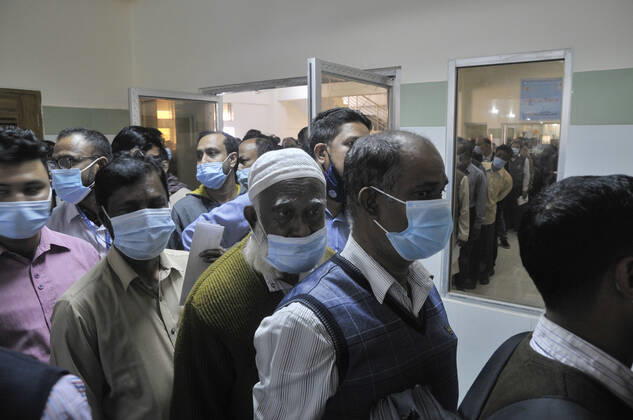 February 11, 2021: People gathered in line to take Covid 19 , vaccination at M A G Osmani Medical College and Hospital, Vaccination Center, Sylhet, Bangladesh - ZUMAr143 20210211_zap_r143_019 Copyright: xMdxRafayatxHaquexKhanx