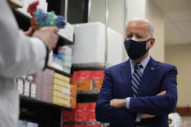 President Joe Biden and Dr. Anthony Fauci speak at the National Institutes of Health on Thursday, February 11, 2021 in Bethesda, Maryland.  WAX20210211935 OliverxContreras