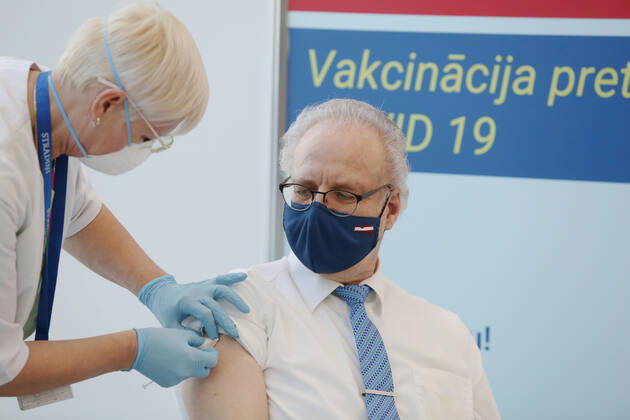 (210211) -- RIGA, Feb. 11, 2021 -- Latvian President Egils Levits (R) receives the COVID-19 vaccine at a hospital in Riga, Latvia, on Feb. 11, 2021. Latvia s top state officials whose office duties involve ensuring national security and the functioning of the state received the first dose of the coronavirus vaccine on Thursday, local media reported. (Photo by Xinhua) LATVIA-RIGA-LEADERS-CORONAVIRUS VACCINE EdijsxPalens 