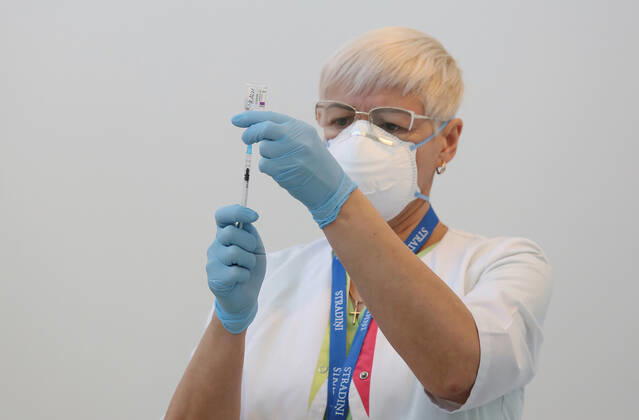 (210211) -- RIGA, Feb. 11, 2021 -- A medical worker prepares the COVID-19 vaccine at a hospital in Riga, Latvia, on Feb. 11, 2021. Latvia s top state officials whose office duties involve ensuring national security and the functioning of the state received the first dose of the coronavirus vaccine on Thursday, local media reported. (Photo by Xinhua) LATVIA-RIGA-LEADERS-CORONAVIRUS VACCINE EdijsxPalens 