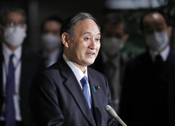 Japan PM Suga after coronavirus meeting Japanese Prime Minister Yoshihide Suga speaks to reporters at his office in Tokyo on Feb. 12, 2021, after a meeting of the government s anti-coronavirus task force. 