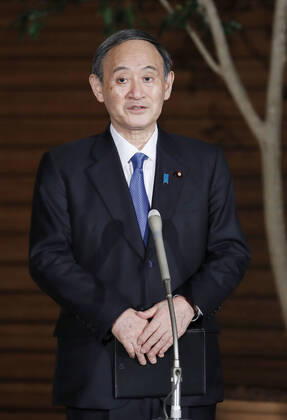 Japan PM Suga after coronavirus meeting Japanese Prime Minister Yoshihide Suga speaks to reporters at his office in Tokyo on Feb. 12, 2021, after a meeting of the government s anti-coronavirus task force. 