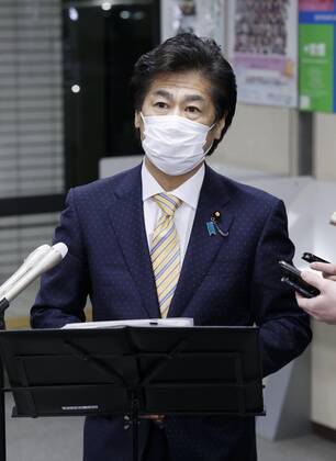 Japan health ministry panel greenlights 1st COVID-19 vaccine Japanese health minister Norihisa Tamura speaks to reporters in Tokyo on Feb. 12, 2021, after a panel of his ministry greenlit the coronavirus vaccine developed by Pfizer Inc. to become the first approved for use in Japan. 