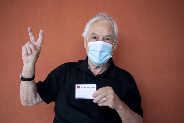 (210212) -- FUTRONO, Feb. 12, 2021 -- Chilean President Sebastian Pinera poses after receiving the COVID-19 vaccine developed by Chinese firm Sinovac at a health center in Futrono, a city in the southern region of Los Rios, Chile, Feb. 12, 2021. ( Handout via Xinhua) CHILE-FUTRONO-PRESIDENT-VACCINE-COVID-19 ChileanxPresidentialxPalace 