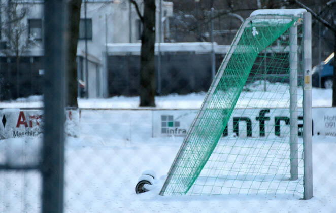 Snow , Soccer field during the Hard Lockdown of the Covid 19 Coronavirus Pandemie in Furth , Bayern , Deutschland . February 12, 2021.