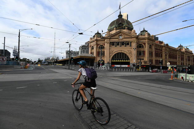 VICTORIA CORONAVIRUS COVID19, A cyclist rides down Swanston Street in Melbourne, Saturday, February 13, 2021. Victoria has entered a short, sharp circuit-breaker lockdown for five days amid fears the highly infectious UK strain of coronavirus has spread in the community. ( NO ARCHIVING, EDITORIAL USE ONLY, NO USE IN BOOKS WITHOUT CONSENT MELBOURNE VIC AUSTRALIA  Copyright: xERIKxANDERSONx 20210213001520219375