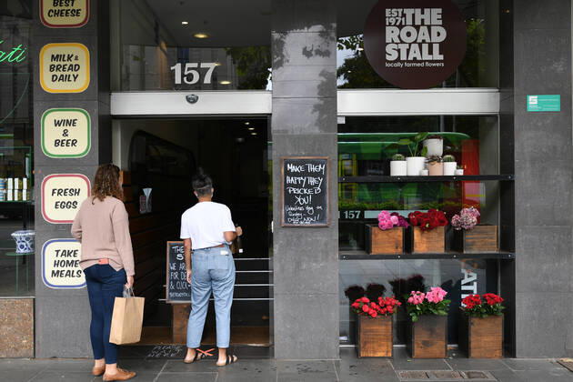 VICTORIA CORONAVIRUS COVID19, Customers order flowers from outside the ?Flowers by The Road Stall? florist in Melbourne, Saturday, February 13, 2021. Victoria has entered a short, sharp circuit-breaker lockdown for five days amid fears the highly infectious UK strain of coronavirus has spread in the community. ( NO ARCHIVING, EDITORIAL USE ONLY, NO USE IN BOOKS WITHOUT CONSENT MELBOURNE VIC AUSTRALIA  Copyright: xERIKxANDERSONx 20210213001520226627
