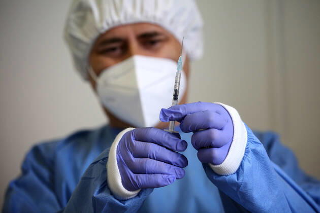 February 13, 2021, Lisbon, Portugal: A health technician prepares a syringe with a dose of the AstraZeneca Covid-19 vaccine on the first day of the security forces inoculation at the Conde de Lippe military barracks in Lisbon, Portugal, on February 13, 2021. Lisbon Portugal - ZUMAf123 20210213_zap_f123_004 Copyright: xPedroxFiuzax