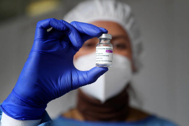 February 13, 2021, Lisbon, Portugal: A health technician prepares a vial of the AstraZeneca Covid-19 vaccine on the first day of the security forces inoculation at the Conde de Lippe military barracks in Lisbon, Portugal, on February 13, 2021. Lisbon Portugal - ZUMAf123 20210213_zap_f123_009 Copyright: xPedroxFiuzax