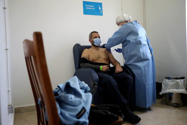 February 13, 2021, Lisbon, Portugal: A National Republican Guard officer receives a first dose of the AstraZeneca Covid-19 vaccine on the first day of the security forces inoculation at the Conde de Lippe military barracks in Lisbon, Portugal, on February 13, 2021. Lisbon Portugal - ZUMAf123 20210213_zap_f123_010 Copyright: xPedroxFiuzax
