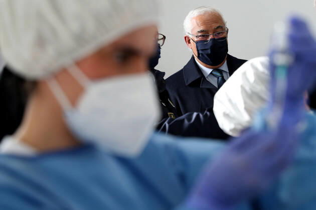February 13, 2021, Lisbon, Portugal: Portuguese Prime Minister Antonio Costa looks on as a health technician fills up a syringe with a dose of the AstraZeneca Covid-19 vaccine on the first day of the security forces inoculation at the Conde de Lippe military barracks in Lisbon, Portugal, on February 13, 2021. Lisbon Portugal - ZUMAf123 20210213_zap_f123_011 Copyright: xPedroxFiuzax