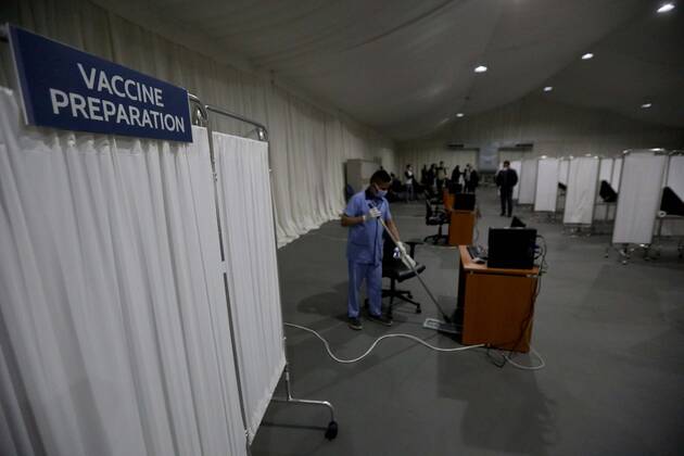 (210213) -- BEIRUT, Feb. 13, 2021 -- People make preparations at a COVID-19 vaccination center at a hospital in Beirut, Lebanon, on Feb. 13, 2021. Lebanon received on Saturday the first batch of Pfizer-BioNTech vaccines with the vaccination campaign set to begin on Sunday. ) LEBANON-BEIRUT-COVID-19 VACCINES-PREPARATIONS BilalxJawich 