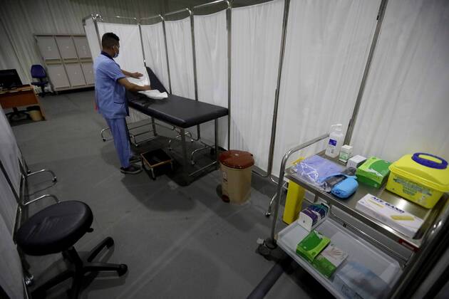 (210213) -- BEIRUT, Feb. 13, 2021 -- A worker is seen in a COVID-19 vaccination center at a hospital in Beirut, Lebanon, on Feb. 13, 2021. Lebanon received on Saturday the first batch of Pfizer-BioNTech vaccines with the vaccination campaign set to begin on Sunday. ) LEBANON-BEIRUT-COVID-19 VACCINES-PREPARATIONS BilalxJawich 