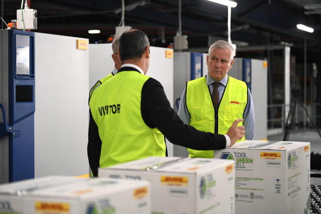 MICHAEL MCCORMACK SYDNEY VISIT, Deputy Prime Minister Michael McCormack, Minister for Regional Health Mark Coulton and DHL Australia CEO Sole Saul Resnick inspect fridges used to store Covid-19 vaccine at a DHL facility in Sydney, Sunday, February 14, 2021. ( NO ARCHIVING, EDITORIAL USE ONLY, NO USE IN BOOKS WITHOUT CONSENT SYDNEY NSW AUSTRALIA  Copyright: xJOELxCARRETTx 20210214001520475624