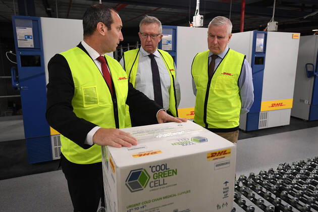MICHAEL MCCORMACK SYDNEY VISIT, Deputy Prime Minister Michael McCormack, Minister for Regional Health Mark Coulton and DHL Australia CEO Sole Saul Resnick inspect fridges used to store Covid-19 vaccine at a DHL facility in Sydney, Sunday, February 14, 2021. ( NO ARCHIVING, EDITORIAL USE ONLY, NO USE IN BOOKS WITHOUT CONSENT SYDNEY NSW AUSTRALIA  Copyright: xJOELxCARRETTx 20210214001520475866