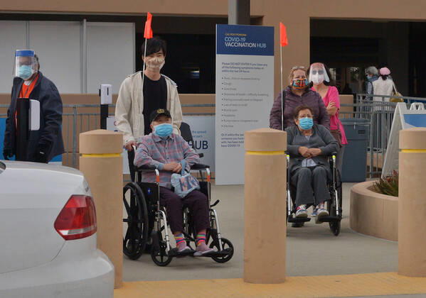 Local residents depart after receiving a COVID-19 shot at the Cal Poly Pomona mass vaccination site in Pomona, California on Saturday, February 13, 2021. A 78-year-old woman passed away unexpectedly Friday shortly after receiving Pfizer s version of the COVID-19 vaccine at the Kaiser-run site. The patient s family said she had a history of heart illness. Her cause of death was yet to be determined, but the Los Angeles County Department of Public Health said by email that there were no signs of allergic or anaphylactic reactions. Her death does not appear to be related to the vaccine, it said.  LAP2021021312 JIMxRUYMEN