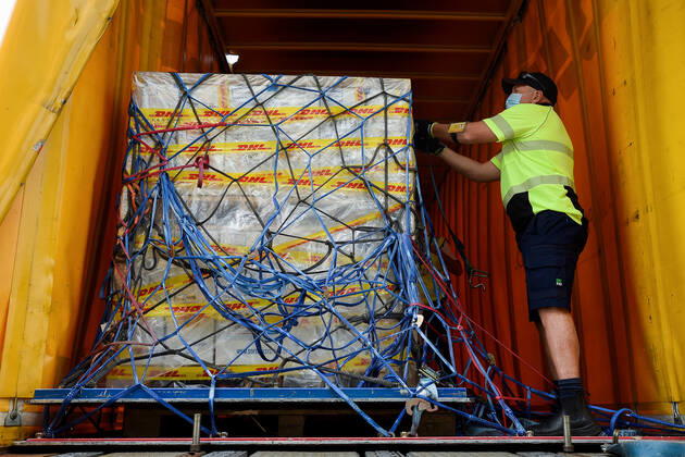 AUSTRALIA PFIZER VACCINE ARRIVAL, The first Australian shipment of Pfizer COVID-19 vaccines is loaded onto a DHL truck for transport to the storage facility after landing at Sydney International Airport on Monday, February 15, 2021. More than 142,000 doses of the Pfizer BioNTech COVID-19 vaccine have arrived at Sydney airport in Australia?s response to the pandemic. This is the first shipment of 20 million doses of the Pfizer vaccine the Government has secured as part of Australia?s COVID-19 Vaccine and Treatment Strategy. ( NO ARCHIVING, EDITORIAL USE ONLY, NO USE IN BOOKS WITHOUT CONSENT  Copyright: xBIANCAxDExMARCHIx 20210215001520722137