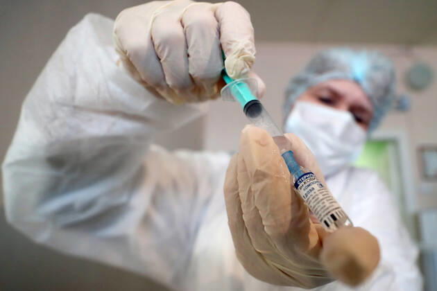 ST PETERSBURG, RUSSIA â€” FEBRUARY 15, 2021: A medical worker fills a syringe with the Gam-COVID-Vac vaccine (under the brand name of Sputnik V) while vaccinating people against COVID-19 at No 7 Neuropsychiatric Care Home. Alexander Demianchuk TASS  TS0F6D1A