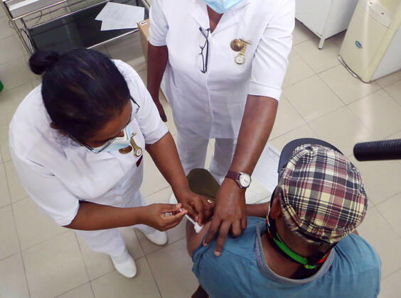 (210215) -- COLOMBO, Feb. 15, 2021 -- A man receives a dose of COVID-19 vaccine in Colombo, Sri Lanka, Feb. 15, 2021. Sri Lankan President Gotabaya Rajapaksa on Monday instructed health authorities to start vaccinating members of the general public in the country s Western Province with the Oxford Astra Zeneca against the COVID-19 virus. Officials said they had started vaccinating those who are at high risk of exposure of the virus, such as port workers, private hospital staff members and even garbage collectors who were based in Western Province. (Photo by Xinhua) SRI LANKA-COLOMBO-COVID-19-VACCINATION AjithxPerera 