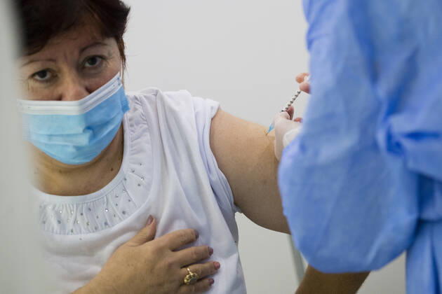 February 15, 2021, Timisoara, Timis, Romania: Woman receives anti COVID-19 vaccine, produced by ASTRAZENECA, at a newly opened vaccination center in Timisoara. Timisoara Romania - ZUMAp180 20210215_zip_p180_002 Copyright: xCornelxPutanx