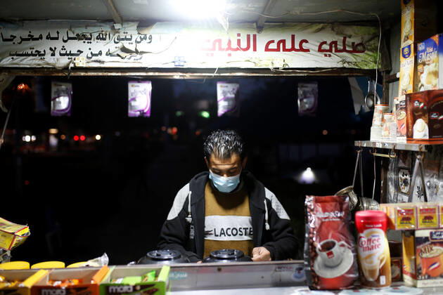 February 15, 2021, Gaza city, Gaza Strip, Palestinian Territory: A Palestinian vendor sells hot drinks, amid the spread of the Coronavirus pandemic, in Gaza City on February 15, 2021 Gaza city Palestinian Territory - ZUMAap3_ 20210215_zaf_ap3_148 Copyright: xOsamaxBabax