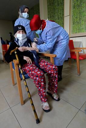 (210215) -- BEIRUT, Feb. 15, 2021 -- An elderly woman receives the COVID-19 vaccine at a nursing home in Beirut, Lebanon on Feb. 15, 2021. Lebanon recorded on Monday 1,793 new COVID-19 cases, raising the total number of infections to 340,861, the Health Ministry reported. Lebanon launched on Sunday its vaccination campaign against COVID-19. ) LEBANON-BEIRUT-COVID-19-VACCINATION-ELDERLY PEOPLE BilalxJawich 