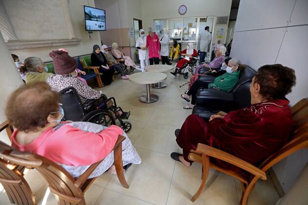 (210215) -- BEIRUT, Feb. 15, 2021 -- Elderly people wait to receive the COVID-19 vaccine at a nursing home in Beirut, Lebanon on Feb. 15, 2021. Lebanon recorded on Monday 1,793 new COVID-19 cases, raising the total number of infections to 340,861, the Health Ministry reported. Lebanon launched on Sunday its vaccination campaign against COVID-19. ) LEBANON-BEIRUT-COVID-19-VACCINATION-ELDERLY PEOPLE BilalxJawich 