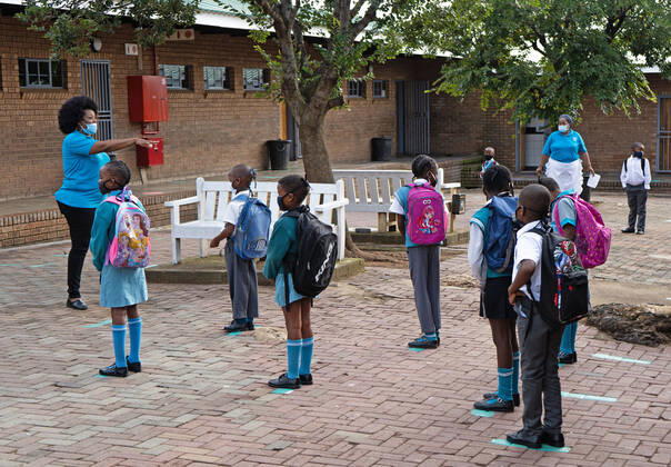 (210216) -- JOHANNESBURG, Feb. 16, 2021 -- Pupils wait to enter the classroom at a primary school in Johannesburg, South Africa, Feb. 15, 2021. Over 20,000 public schools in South Africa were reopened in accordance with strict adherence to the COVID-19 protocol on Monday. (Photo by Xinhua) SOUTH AFRICA-JOHANNESBURG-COVID-19-PUBLIC SCHOOL-REOPEN MatthewxMartinxBrink 