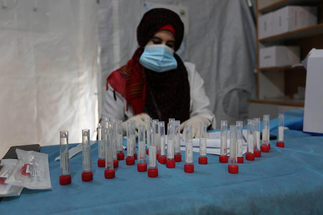February 16, 2021, Khan Younis, Gaza Strip, Palestinian Territory: A Palestinian health worker collects a swab sample from a person for Covid-19 test in Khan Younis in the southern Gaza Strip, on February 16, 2021. The Palestinian Authority accused Israel of refusing to allow some 2,000 coronavirus vaccine doses destined for Gaza health workers into the blockaded coastal strip Khan Younis Palestinian Territory - ZUMAap3_ 20210216_zaf_ap3_061 Copyright: xAshrafxAmrax