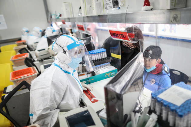 (210216) -- SHENYANG, Feb. 16, 2021 -- Sun Hewen, a medical worker with Shengjing Hospital of China Medical University, collects nucleic acid samples in Shenyang, capital of northeast China s Liaoning Province, Feb. 16, 2021. Since December last year, some areas in China s northeastern Heilongjiang, Jilin, and Liaoning Provinces reported newly confirmed COVID-19 cases. Related areas responded immediately according to epidemic prevention requirements. Mass nucleic acid testing were conducted in key areas in an effort to stem the spread of the coronavirus. Recently, no new confirmed COVID-19 cases have been reported here for several days. During the Spring Festival vacation, many workers stick to their posts to make sure we can celebrate the