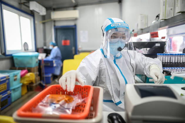(210216) -- SHENYANG, Feb. 16, 2021 -- Sun Hewen, a medical worker with Shengjing Hospital of China Medical University, collects nucleic acid samples in Shenyang, capital of northeast China s Liaoning Province, Feb. 16, 2021. Since December last year, some areas in China s northeastern Heilongjiang, Jilin, and Liaoning Provinces reported newly confirmed COVID-19 cases. Related areas responded immediately according to epidemic prevention requirements. Mass nucleic acid testing were conducted in key areas in an effort to stem the spread of the coronavirus. Recently, no new confirmed COVID-19 cases have been reported here for several days. During the Spring Festival vacation, many workers stick to their posts to make sure we can celebrate the