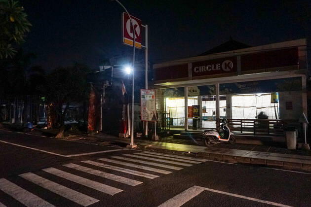 February 16, 2021, Badung, Bali, Indonesia: Closed shops at Seminyak Street during curfew time..Bali famous tourism-shopping area of Seminyak s condition after 9:00 pm curfew amid covid-19 pandemic. Badung Indonesia - ZUMAs197 20210216_zaa_s197_139 Copyright: xDickyxBisinglasix