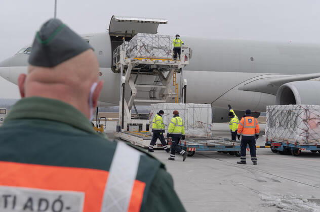 (210217) -- BUDAPEST, Feb. 17, 2021 -- Staff members transfer the first batch of China s Sinopharm COVID-19 vaccine purchased by Hungary at the Liszt Ferenc International Airport in Budapest, Hungary, Feb. 16, 2021. (Photo by Xinhua) HUNGARY-BUDAPEST-COVID-19-VACCINE FROM CHINA-ARRIVAL AttilaxVolgyi 
