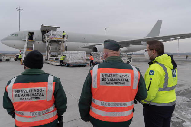 (210217) -- BUDAPEST, Feb. 17, 2021 -- Staff members transfer the first batch of China s Sinopharm COVID-19 vaccine purchased by Hungary at the Liszt Ferenc International Airport in Budapest, Hungary, Feb. 16, 2021. (Photo by Xinhua) HUNGARY-BUDAPEST-COVID-19-VACCINE FROM CHINA-ARRIVAL AttilaxVolgyi 