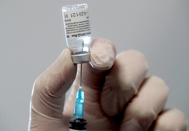 MOSCOW, RUSSIA â€“ FEBRUARY 17, 2021: A nurse fills a syringe with the Gam-COVID-Vac vaccine (under the brand name of Sputnik V) at a new temporary COVID-19 vaccination site in the VDNKh Exhibition Centre. A mobile vaccination team is providing vaccines free of charge and without prior sign-up. Since the start of the pandemic, Moscow has confirmed more than 960,600 cases of COVID-19. Since late January, the number of new confirmed cases has been increasing in the Russian capital by more than 1,200 daily. Sergei Savostyanov TASS  TS0F701F