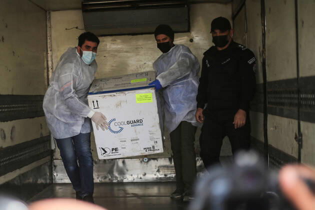 February 17, 2021, Southern the Gaza Strip, The Gaza Strip, Palestine: Palestinian medical received, at Karm Abu Salem Kerem Shalom commercial crossing southern the Gaza Strip, the Russian COVID-19 vaccines delivered from the Palestinian Authority in Ramallah, after a two-day delay from Israeli authorities. Southern the Gaza Strip Palestine - ZUMAq100 20210217_zaa_q100_003 Copyright: xMahmoudxKhattabx
