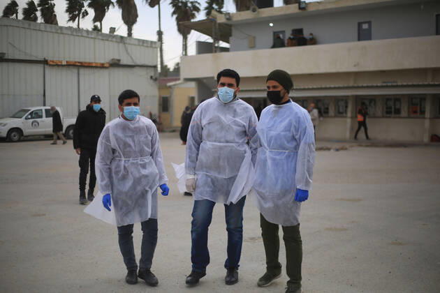 February 17, 2021, Southern the Gaza Strip, The Gaza Strip, Palestine: Palestinian medical received, at Karm Abu Salem Kerem Shalom commercial crossing southern the Gaza Strip, the Russian COVID-19 vaccines delivered from the Palestinian Authority in Ramallah, after a two-day delay from Israeli authorities. Southern the Gaza Strip Palestine - ZUMAq100 20210217_zaa_q100_008 Copyright: xMahmoudxKhattabx