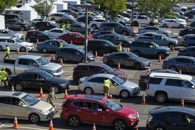 February 17, 2021, Los Angeles, California, USA: Motorists and passengers wait in line for their Covid-19 vaccinations administered by members of the National Guard at a joint state and federal COVID-19 vaccination site on the campus of California State University of Los Angeles in Los Angeles, Wednesday, Feb. 17, 2021. Los Angeles USA - ZUMAc68_ 20210217_zaf_c68_012 Copyright: xRingoxChiux