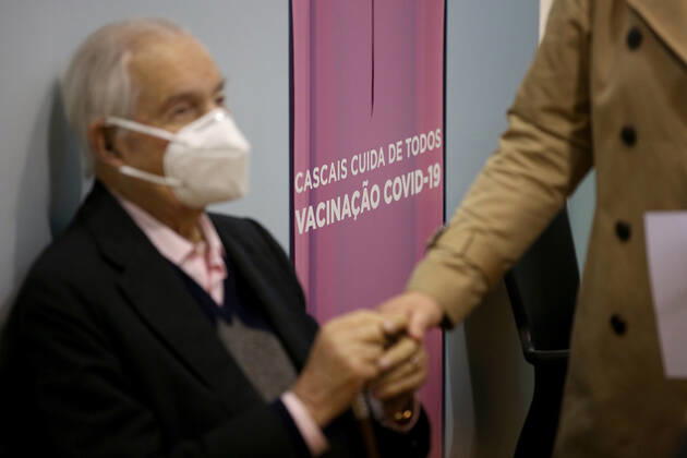 February 18, 2021, Lisbon, Portugal: People wait in front of vaccination booths to be inoculated with the Pfizer-BioNTech Covid-19 vaccine at Sao Domingos de Rana sports complex, in Cascais, Portugal, on February 18, 2021. Portugal continues with the first phase of inoculation against COVID-19 for citizens over 80 or belonging to risk groups as the number of new officially confirmed COVID-19 cases has been falling since the end of January. Lisbon Portugal - ZUMAf123 20210218_zap_f123_002 Copyright: xPedroxFiuzax