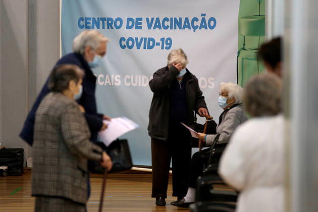 February 18, 2021, Lisbon, Portugal: People wait in front of vaccination booths to be inoculated with the Pfizer-BioNTech Covid-19 vaccine at Sao Domingos de Rana sports complex, in Cascais, Portugal, on February 18, 2021. Portugal continues with the first phase of inoculation against COVID-19 for citizens over 80 or belonging to risk groups as the number of new officially confirmed COVID-19 cases has been falling since the end of January. Lisbon Portugal - ZUMAf123 20210218_zap_f123_006 Copyright: xPedroxFiuzax