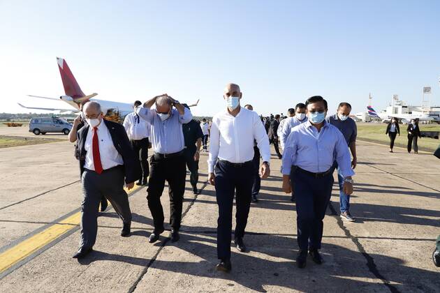 From left to right, General Maximo Diaz Caceres, Minister of the National Defense Council; Joaquin Roa, Minister of the National Emergency Secretariat; Julio Mazzoleni, Minister of Health; and Felix Kanasawa, President of the National Civil Aeronautics Directorate, walk after receiving the shipment of 4,000 Russian Sputnik V vaccines that arrived at Silvio Pettiross airport, in Ciudad Luque, Paraguay, 18 February 2021. 4,000 doses of the Russian Sputnik V vaccine arrive in Paraguay !ACHTUNG: NUR REDAKTIONELLE NUTZUNG! Copyright: xNathaliaxAguilarx AME6807 20210218-637492852811789107