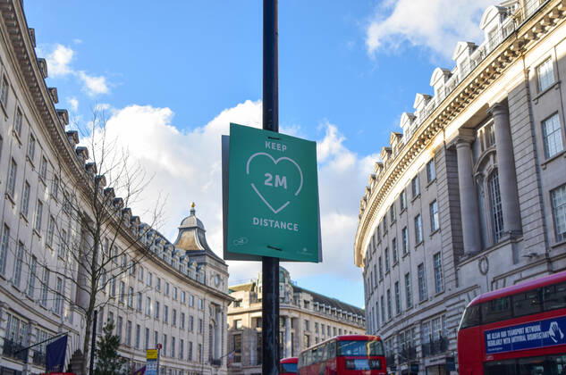 February 18, 2021, London, United Kingdom: The Keep 2 Meters Distance sign seen on Regent Street in London..Coronavirus cases are falling across the UK, as the government prepares to present its plan for easing the lockdown restrictions. London United Kingdom - ZUMAs197 20210218_zaa_s197_196 Copyright: xVukxValcicx