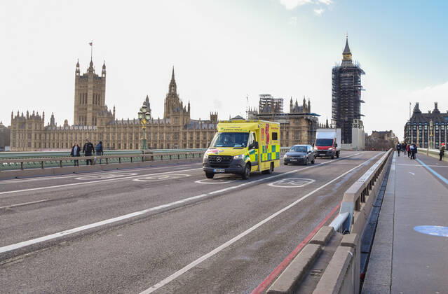 February 18, 2021, London, United Kingdom: An ambulance drives past the Houses of Parliament on Westminster Bridge in London..Coronavirus cases are falling across the UK, as the government prepares to present its plan for easing the lockdown restrictions. London United Kingdom - ZUMAs197 20210218_zaa_s197_200 Copyright: xVukxValcicx