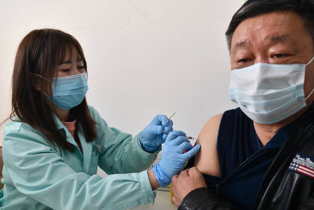 February 19, 2021, Shijiazhuang, Hebei, China: People are getting the second needle of COVID-19 vaccine in Shijiazhuang,Hebei,China on 19th February, 2021. Shijiazhuang China - ZUMAt151 20210219_zia_t151_010 Copyright: xTpgx